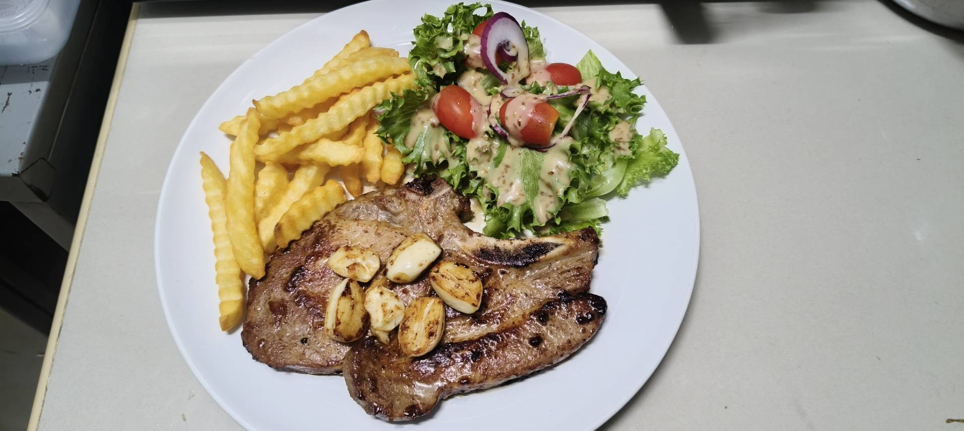 Steak with salad and french fries